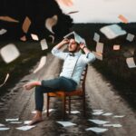 Storytelling - man sitting on chair with book