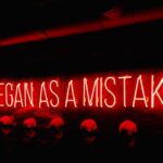 Mistakes - a neon sign that says itbegan as a mistake